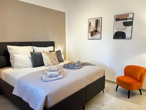 a bedroom with a bed with towels on it at Apartment Sunset - Private Pool & Sea View in Bar