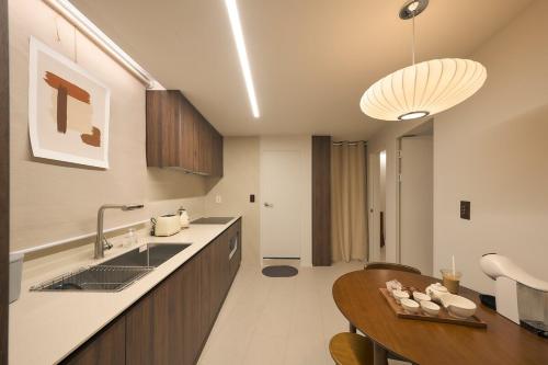 a kitchen with a sink and a counter top at Stay Seongsu Villa in Seoul