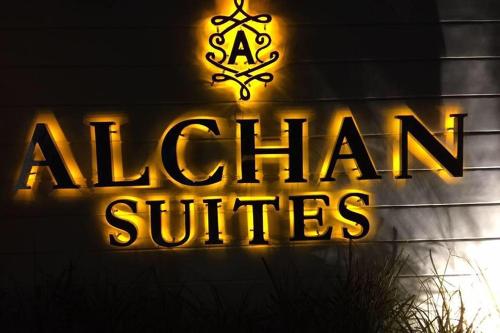 a neon sign for a restaurant with a christmas at Alchan Suites in General Santos
