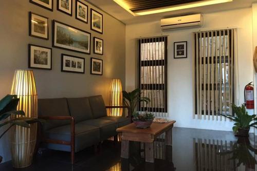 a living room with a couch and a table at Alchan Suites in General Santos