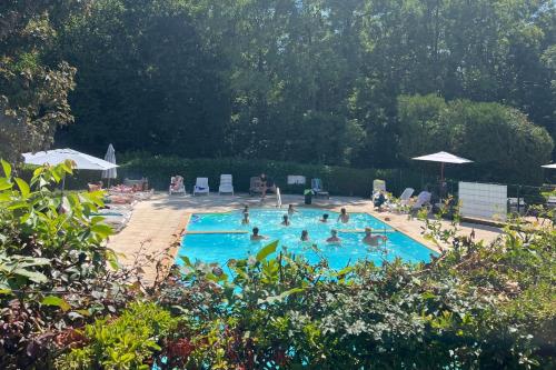 a group of people in a swimming pool at Camping le Relais du Léman in Messery