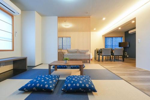 a living room with two pillows and a table at Seed INN Haneda Terrace 301 in Tokyo