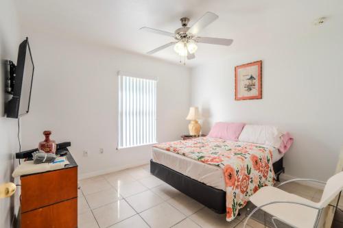 a bedroom with a bed and a ceiling fan at Flint and Kingscrest, LLC - Private Rooms in Shared Home in Orlando