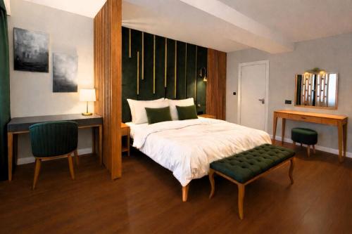 a bedroom with a bed and a desk and a chair at Best Western Izmir Hotel in İzmir