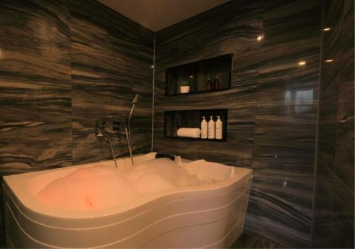a bathroom with a bath tub in a room at Best Western Izmir Hotel in İzmir