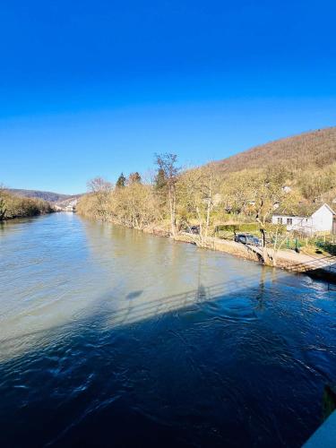 a view of a river from a bridge at Riverside Cabin Surrounded by Nature for Two in Esneux