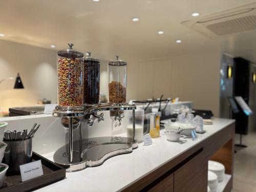 a kitchen counter with two large containers of sprinkles at Hotel Prince Seoul in Seoul