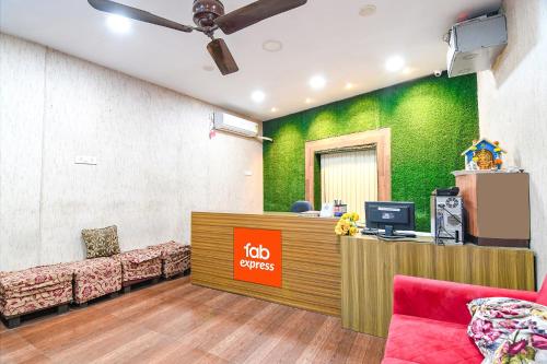 an office with ahi services sign on a green wall at FabHotel Vhyom Sky Palace in Kolkata