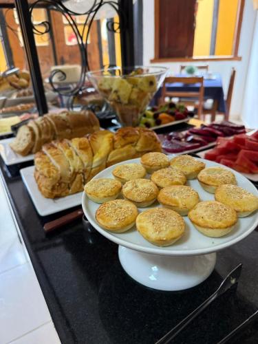 a plate of cookies and pastries on a table at Pousada Mangue Seco in Itaúnas