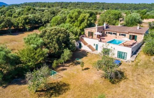 an aerial view of a house with a swimming pool at Can Baldo in Sencelles
