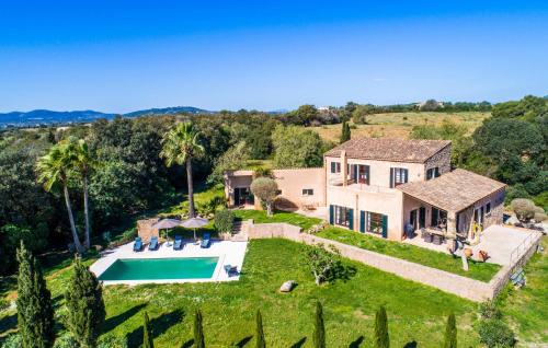 an aerial view of a house with a swimming pool at Esteva in Sant Llorenç des Cardassar