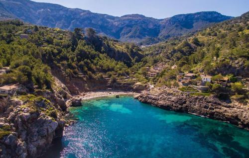 an aerial view of a river in the mountains at Antonio in Deia