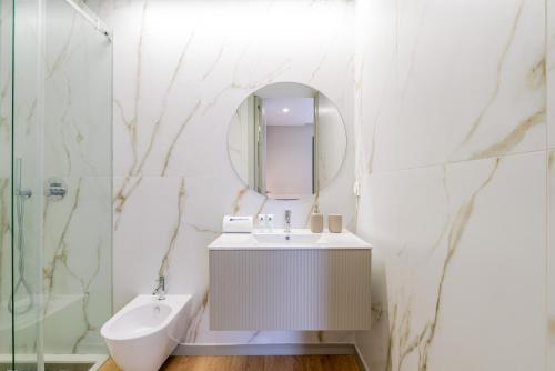 a bathroom with a sink and a mirror at Modern Porto Retreat by HostWise in Vila Nova de Gaia