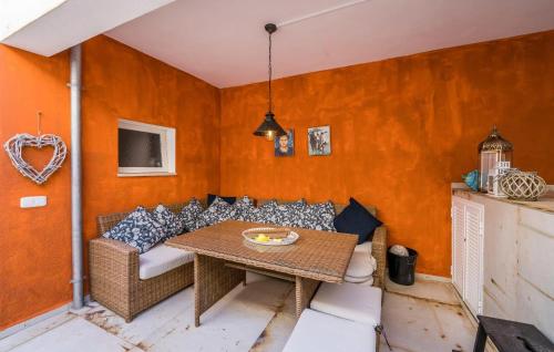 a living room with a couch and a table at Ca Sa Batlessa in Artá