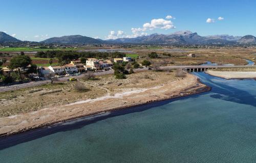 an aerial view of a river with a bridge at Sa Fornera in Alcudia