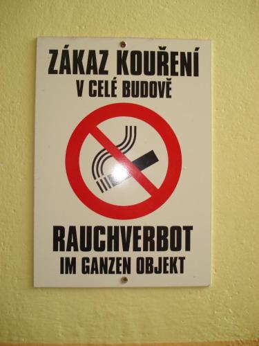 a sign on a wall with a no smoking sign at Pension Martinské údolí - dependance in Kořenov