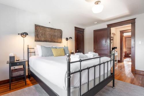 a bedroom with a large white bed in a room at Boscobel Bungalow in Nashville