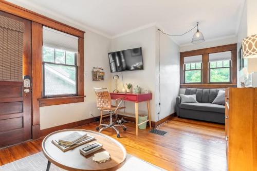 a living room with a couch and a table at Boscobel Bungalow in Nashville