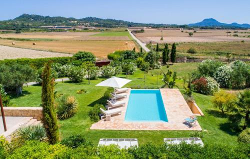 an external view of a garden with a swimming pool at Son Artigues in Manacor