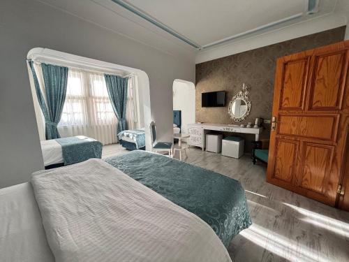 Katil atau katil-katil dalam bilik di Urcu Hotel