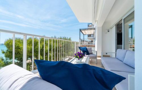 a living room with a couch and a balcony at Voramar On Pinewalk in Pollença
