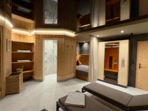 a large room with a bed and a bedroom at Residence Untermoarhof in Brunico