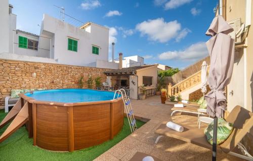 a hot tub in the yard of a house at Casa Hermosa in Capdepera