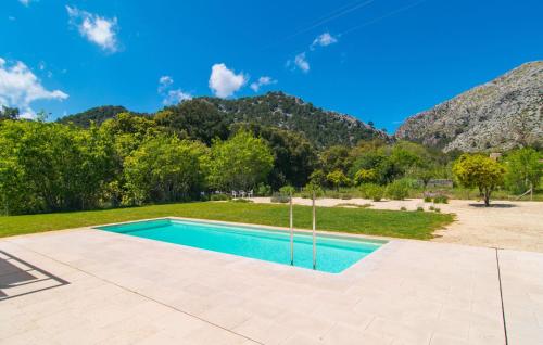 an image of a swimming pool with mountains in the background at Ternelles in Pollença
