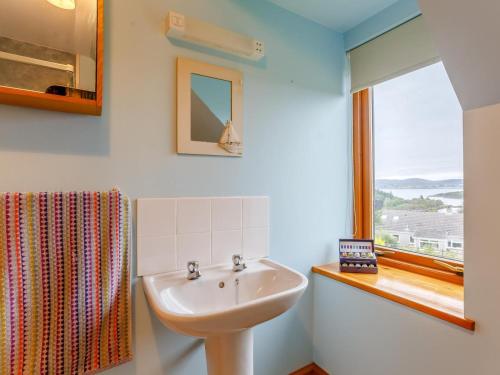 a bathroom with a sink and a window at 4 Bed in Gairloch oc-ca390 in Strath