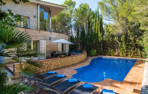 a swimming pool in the backyard of a house at Cocodrilo in Alcudia