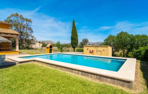 a swimming pool in the yard of a house at Can Jaume Pollenca in Pollença