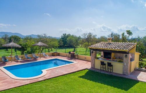 a swimming pool in a yard with a gazebo at Ca Na Conceda in Alcudia