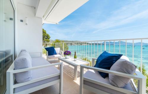 a balcony with chairs and a view of the ocean at Voramar On Pinewalk in Pollença