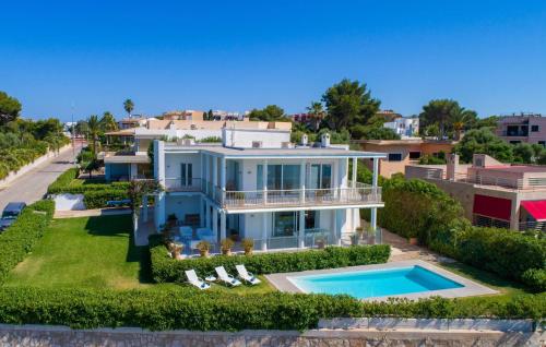 an aerial view of a house with a swimming pool at Esperanza in Portocolom