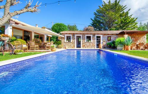 a swimming pool in front of a house at Can Sion in Esporlas