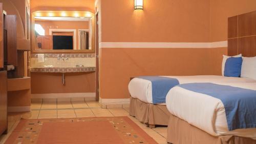 Postel nebo postele na pokoji v ubytování Hotel El Rebozo
