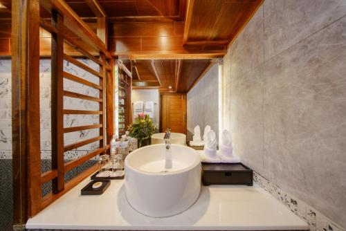 a bathroom with a large white tub in a room at Calisto Valley I Luxury Pool Villa Krabi in Ao Nam Mao