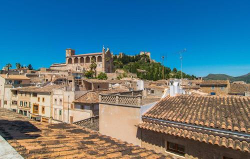 a view of a city from the roofs of buildings at Roser De Arta in Artá