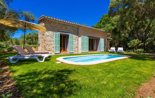 a house with a swimming pool in a yard at Na Mikeleta in Capdepera