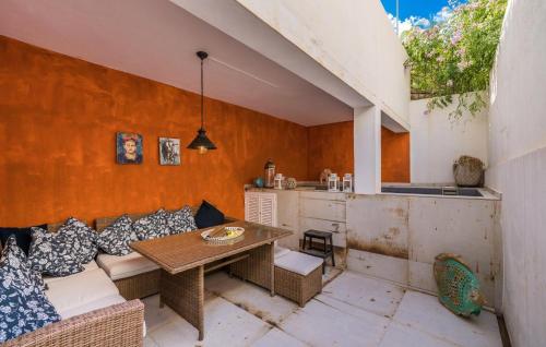an outdoor patio with a couch and a table at Ca Sa Batlessa in Artá