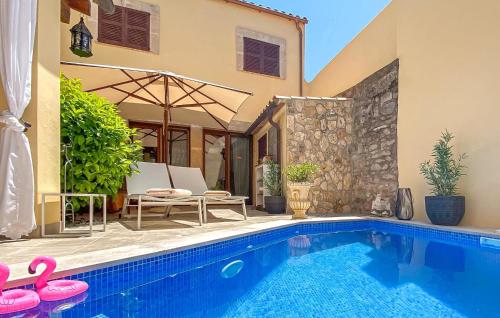 a villa with a swimming pool and a house at Casa Vida Arta in Artá