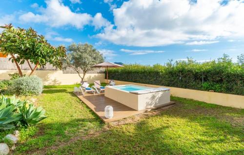 a backyard with a swimming pool and a hot tub at Sa Copinya in Cala Bona