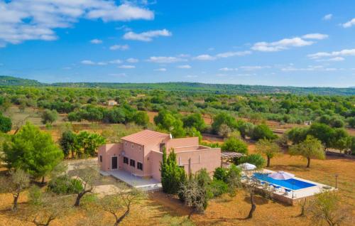 an aerial view of a house with a swimming pool at Ses Comunes in Campos