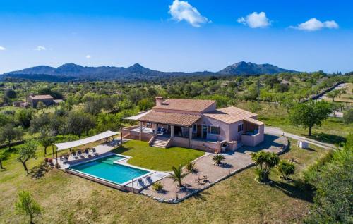 an aerial view of a house with a swimming pool at S'oratge in Artá