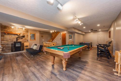 a living room with a pool table in it at Arcadia by Railey Vacations in McHenry