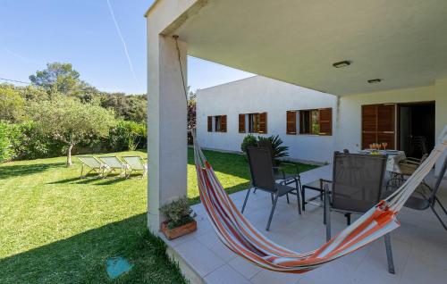 a hammock on a porch of a house at Amedart in Alcudia