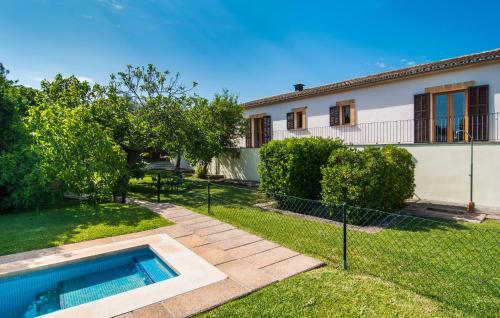 a house with a swimming pool in the yard at Can Polito in Can Picafort