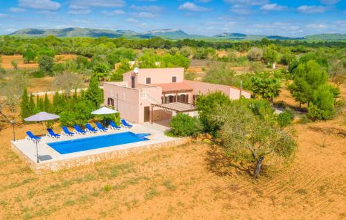 an aerial view of a house with a swimming pool at Ses Comunes in Campos