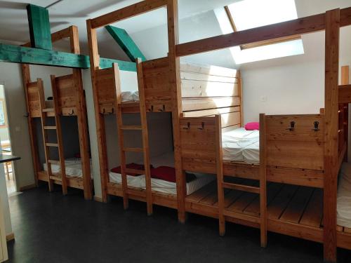 a group of four bunk beds in a room at gite des Hauts Plateaux in Corrençon-en-Vercors