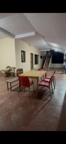 a room with a ping pong table and two chairs at Offline Resort in Bengaluru, Karnataka